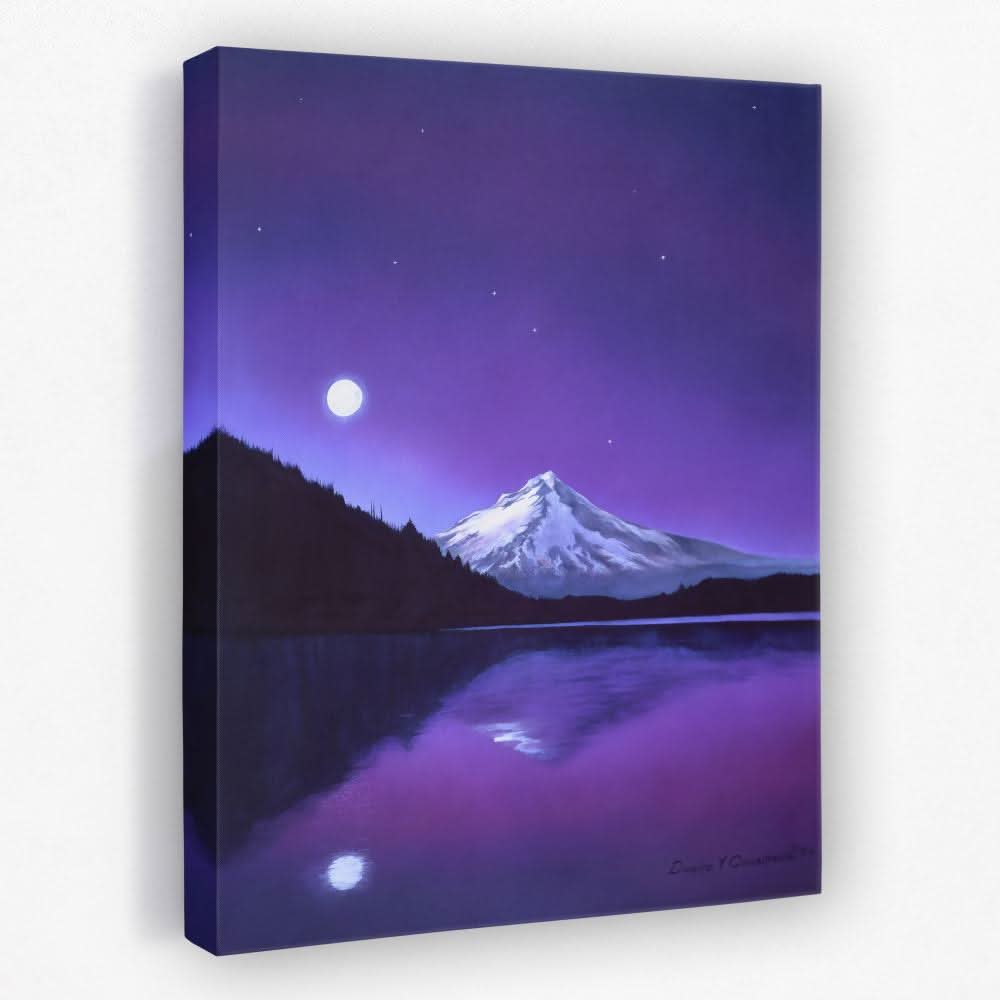 A beautifully wrapped canvas print being presented as a gift alongside flowers and a handwritten card on a wooden table
