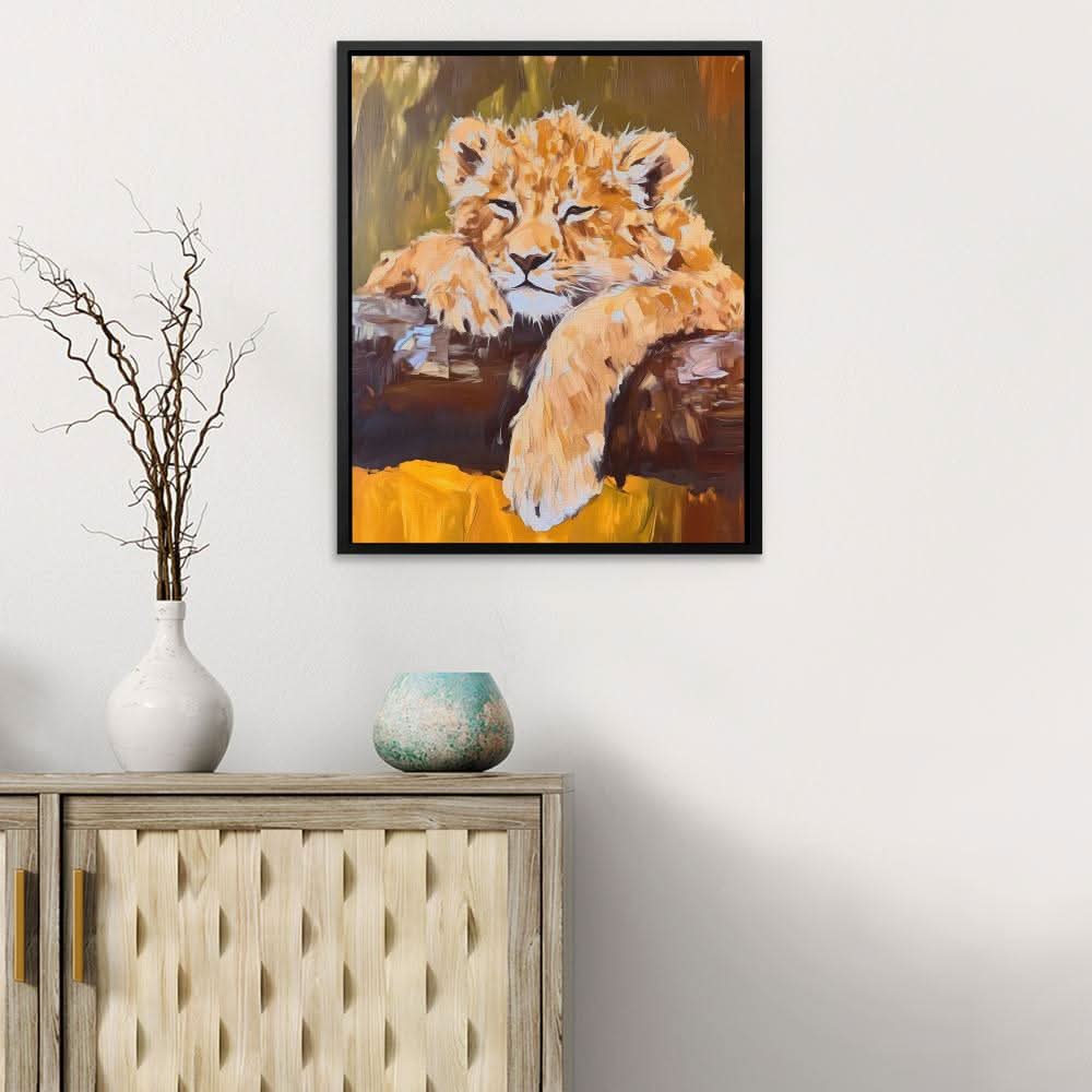 Lazy Lion Cub - Baby Animal Wall Art in Black Frame